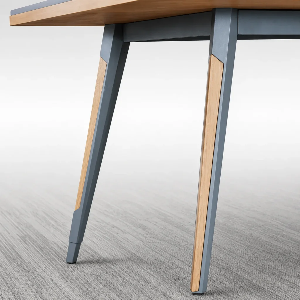 Modern conference room tables, close-up of the angled wood and gray metal leg