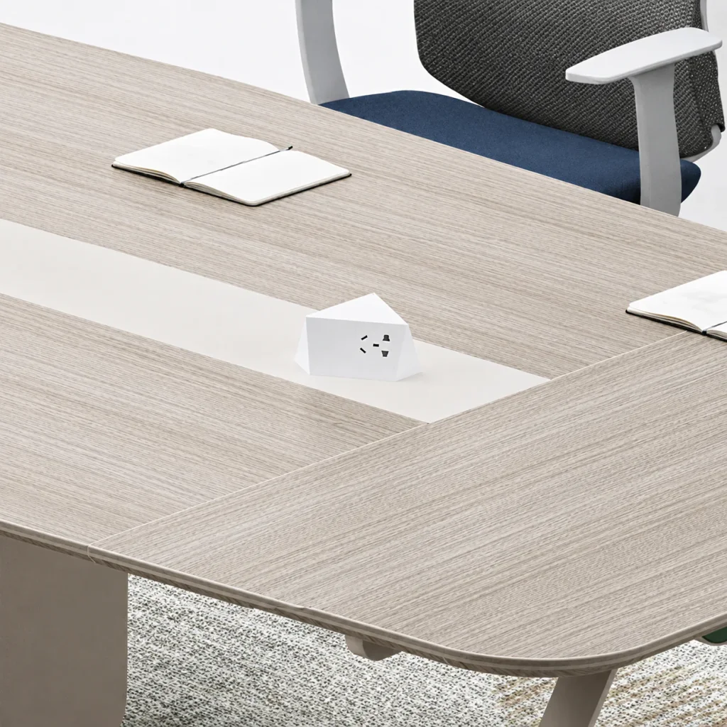 Small meeting table, close-up of the tabletop with built-in power outlet