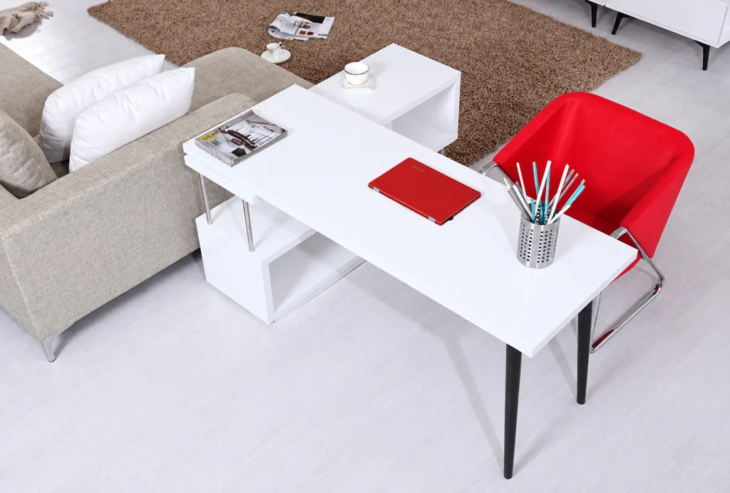 Compact Storage Office Desk in white with black legs next to a sofa, top view
