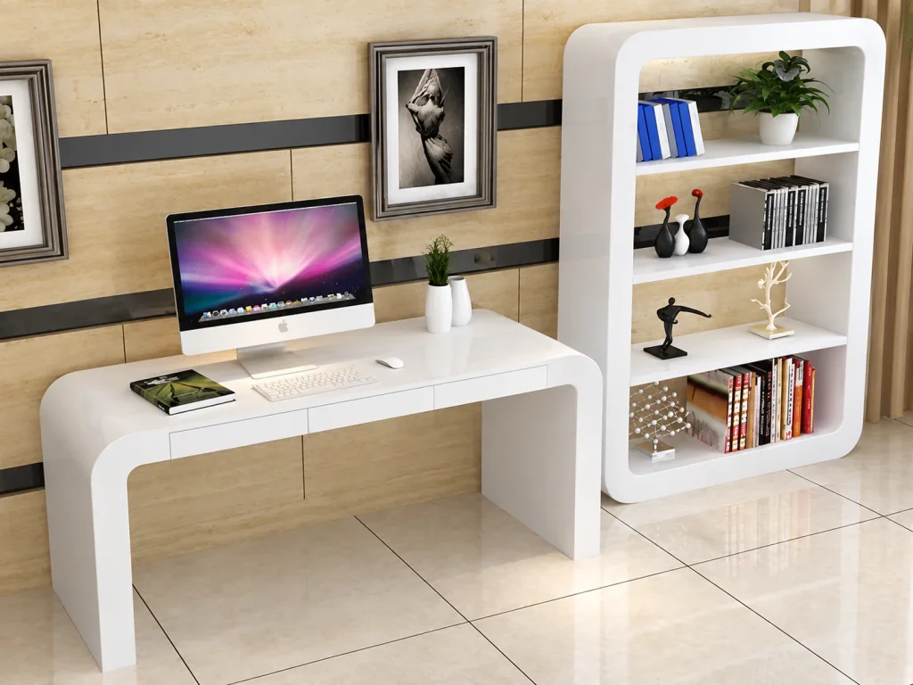 Rounded Compact Office Desk in white next to a matching white bookcase